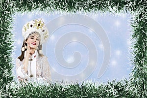 Christmas design-Christmas card with a beautiful, young, smiling woman dressed as Santa Claus, bordered by pine needles with a