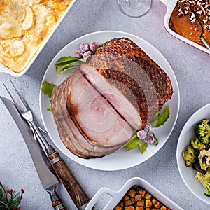 Christmas dinner with honey spiral sliced ham and side dishes