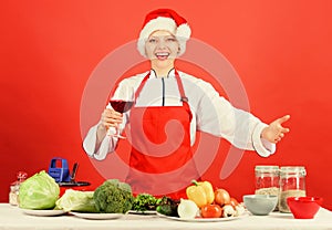 Christmas dinner idea. Christmas menu. Woman chef or housewife cooking and drink wine. No stress. Best christmas recipes