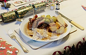 Christmas dinner plate roast turkey parsnips potatoes sprouts stuffing and gravy