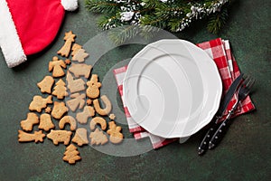 Christmas dinner plate, silverware, fir tree, cookies