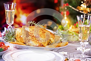 Christmas dinner with roasted chicken and champagne