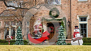 Christmas display on a lawn in Dallas, Texas, with Santa and Frosty the Snowman. photo