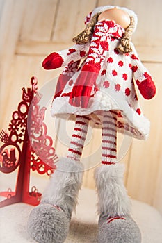 Christmas Doll and a red christmas tree