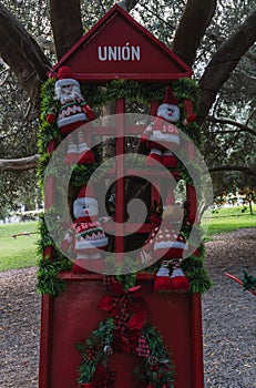 Christmas dolls ganging from trees photo