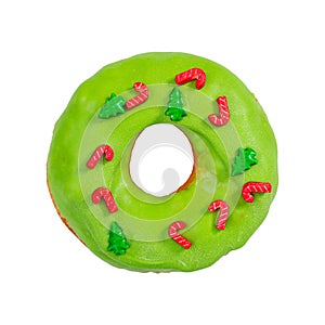 Christmas donut with green icing and sprinkles isolated on white