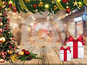 Christmas double border of ornaments, trees, branches and buffalo plaid check ribbon. front view on an old wooden table background