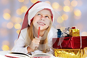 Christmas dreams. little girl writing a letter to Santa Claus