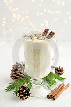 Christmas drink eggnog with whipped cream and cinnamon