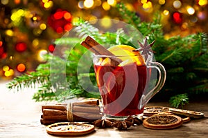 Christmas drink. Glass of hot mulled wine with oranges, anise and cinnamon