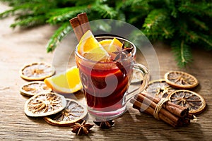 Christmas drink. Glass of hot mulled wine with oranges, anise and cinnamon