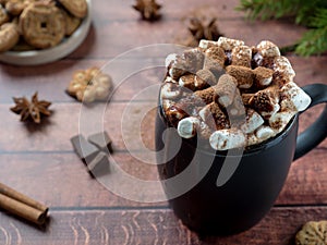 Christmas drink Hot chocolate with marshmallow and cinnamon sticks, cookies. Christmas winter concept. Close up