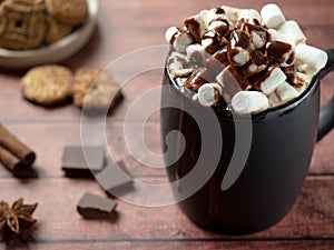 Christmas drink Hot chocolate with marshmallow and cinnamon sticks, cookies. Christmas winter concept. Close up