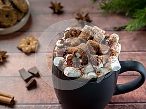 Christmas drink Hot chocolate with marshmallow and cinnamon sticks, cookies. Christmas winter concept. Close up