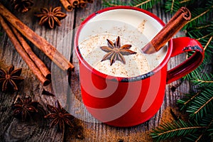 Christmas drink: hot white chocolate with cinnamon and anise in red mug