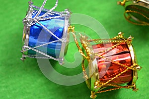 Christmas drums on green background.