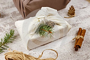 Christmas eco friendly gift wrapping in traditional Japanese Furoshiki style. Environmental present wrapping concept. Presents
