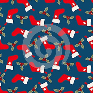 Christmas elements seamless pattern with Red sock and holly leaves and berries ornate.