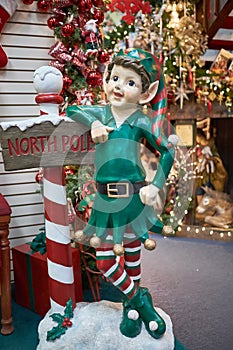 Christmas Elf and North Pole sign