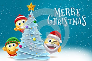 Christmas emojis character vector design. Merry christmas text with santa claus, elf and smiley characters decorating xmas tree.