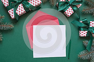 Christmas empty blank letter to Santa or invitation on green. Top view