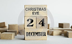 CHRISTMAS EVE is written on wooden cubes stacked in the form of a mobile calendar