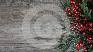 Christmas Evergreen Branches and Berries Over Rustic Wood Horizontal Background