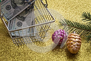 Christmas expenses / holiday decortions and United States dollars in the shopping cart / concept