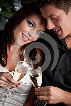 Christmas: extravagant couple with champagne