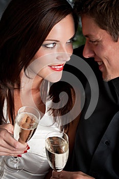 Christmas:Extravagant young couple with champagne