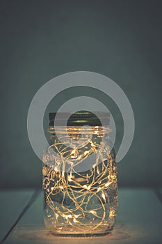 Christmas fairy lights in a mason jar photo
