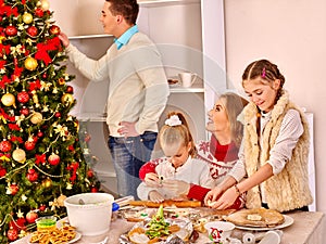 Christmas family dinner children rolling dough in kitchen Xmas party