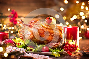 Christmas family dinner. Holiday decorated table with turkey