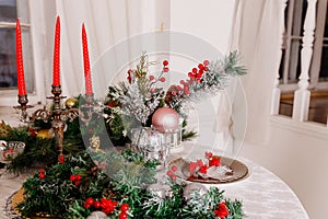 Christmas Family Dinner Table Concept.Table setting for new year dinner.decorations, candles and lanterns. white