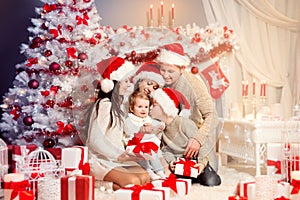 Christmas Family Front of Xmas Tree Opening Present Gifts, Happy Father Mother Children