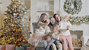 Christmas family greetings using digital tablet at home