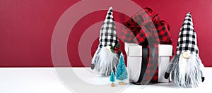 Christmas farmhouse black red and white plaid check gnomes and gift.