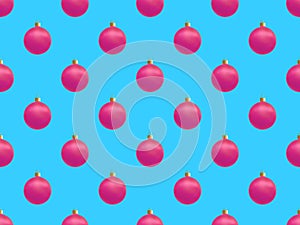 Christmas fashion seamless pattern with pink realistic balls on blue background.