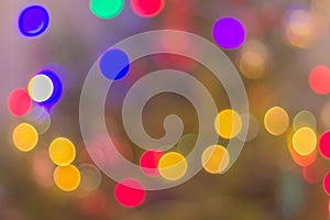 Christmas festive abstraction from multi-colored circles on a blurred background for congratulations.