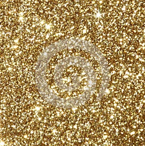 Christmas festive background. Abstract shiny gold defocused glitter bokeh