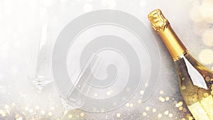 Christmas festive background with champagne bottle and wine glasses, golden christmas balls and decor, top view banner