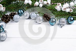 Christmas festive background with fir branches and Christmas tree decorations. Top view. Close-up. Copy space