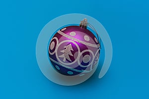 Christmas festive balloon with the image of a spruce and snowflakes for decoration on a turquoise background