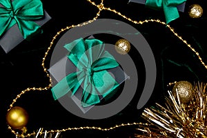 Christmas festive black gift boxes with green ribbon