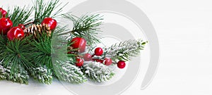 Christmas festive decoration with fir tree branches ,snow and re