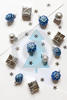 Christmas festive flat lay composition with Christmas balls and gift boxes