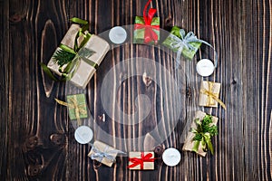 Christmas Festive Gift box and Decoration red, gold, green ribbon,Copyspace, Dark Backdrop,Round Frame