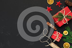 Christmas festive gift boxes and decorations on black background