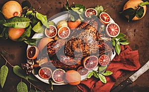 Christmas festive table setting with whole roasted turkey