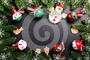 Christmas fir branches with decorations on a black background